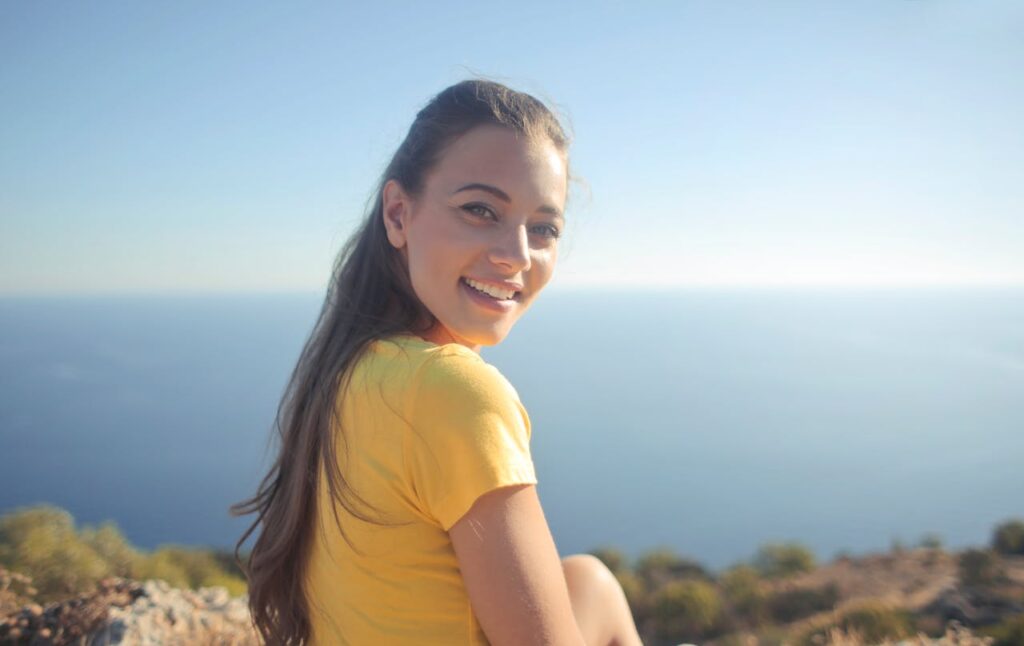 Frau lächeln Sonne Spirituelle Bedeutung des Namens Angelika